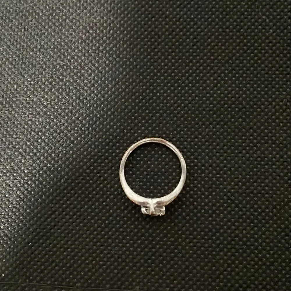 Thin ring with a white gem